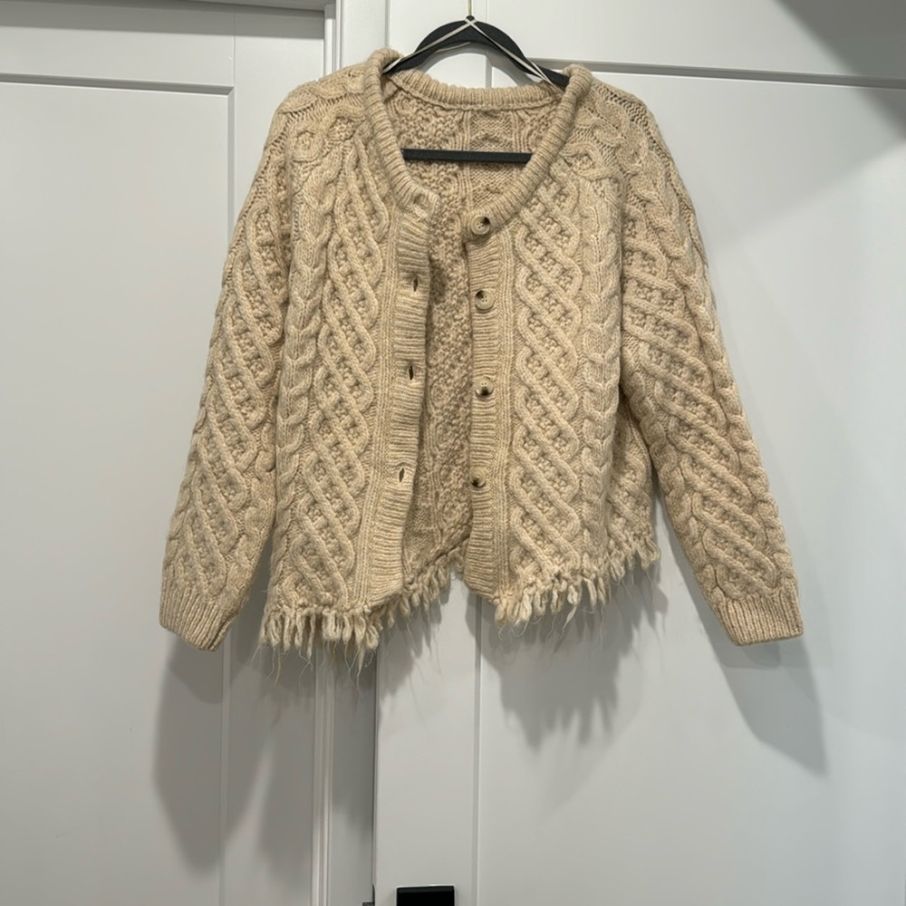 Asymmetrical cardigan sweater.